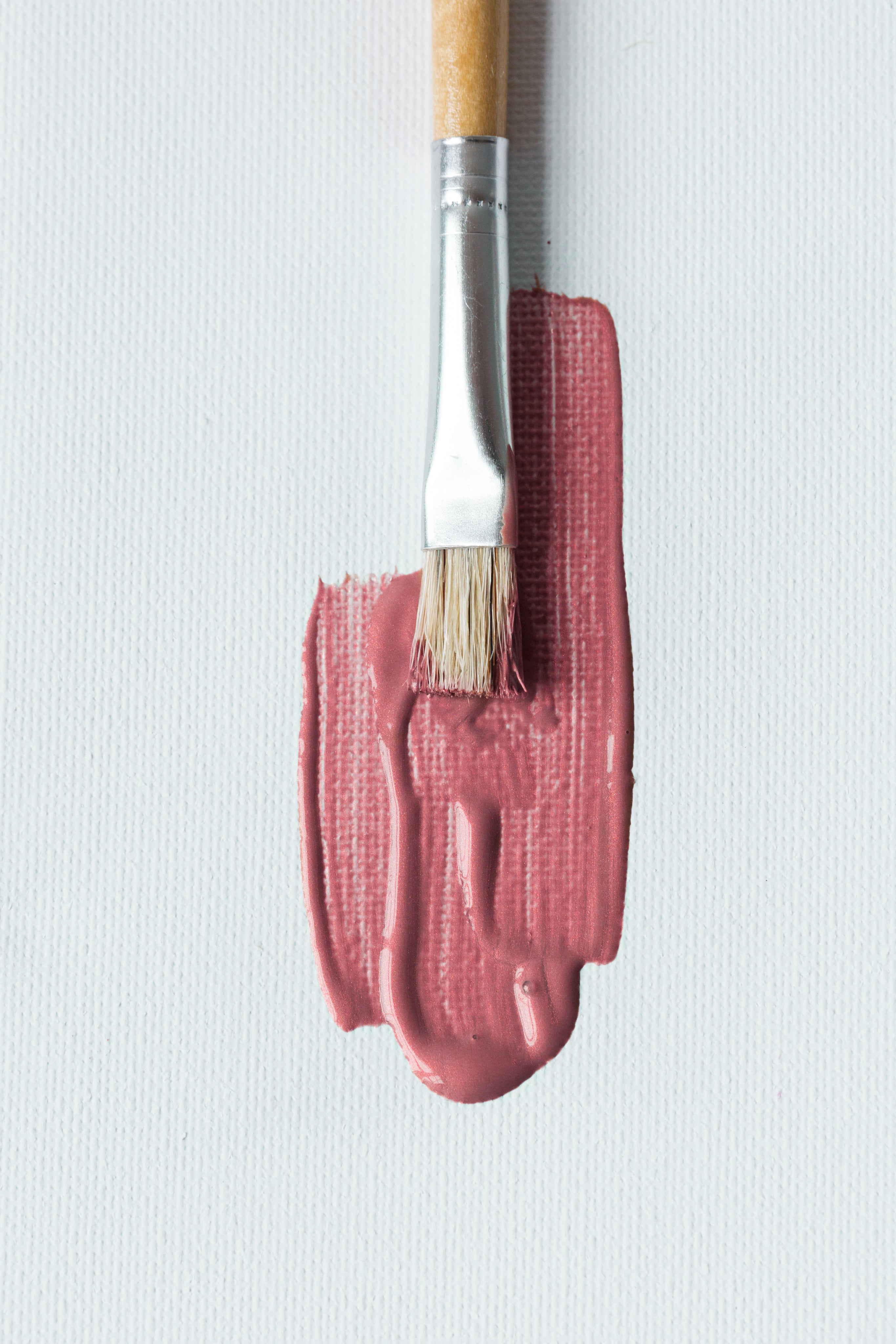 paintbrush-with-pink-on-canvas.jpg